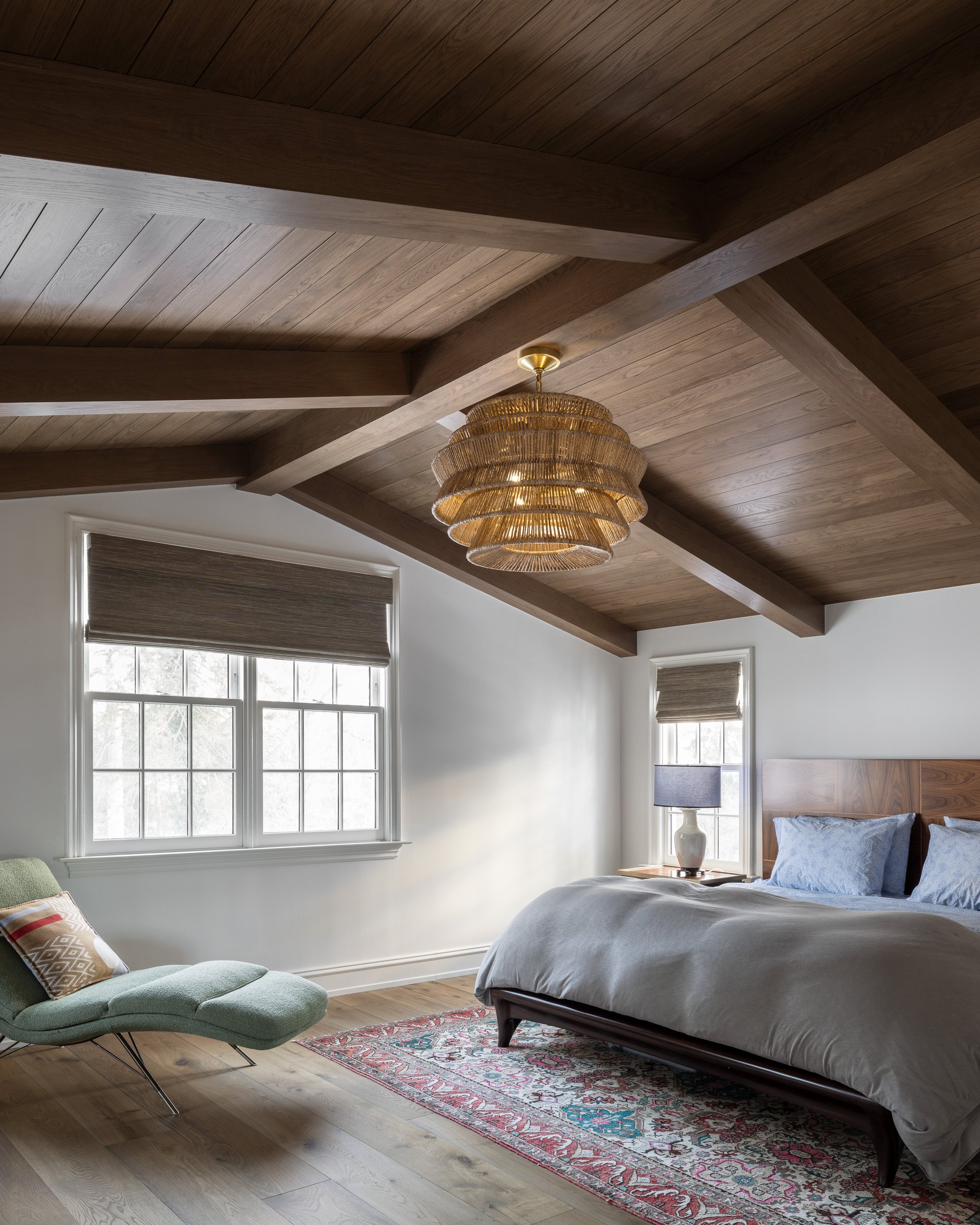 Bedroom with a beamed ceiling, built by Mosher Dolan