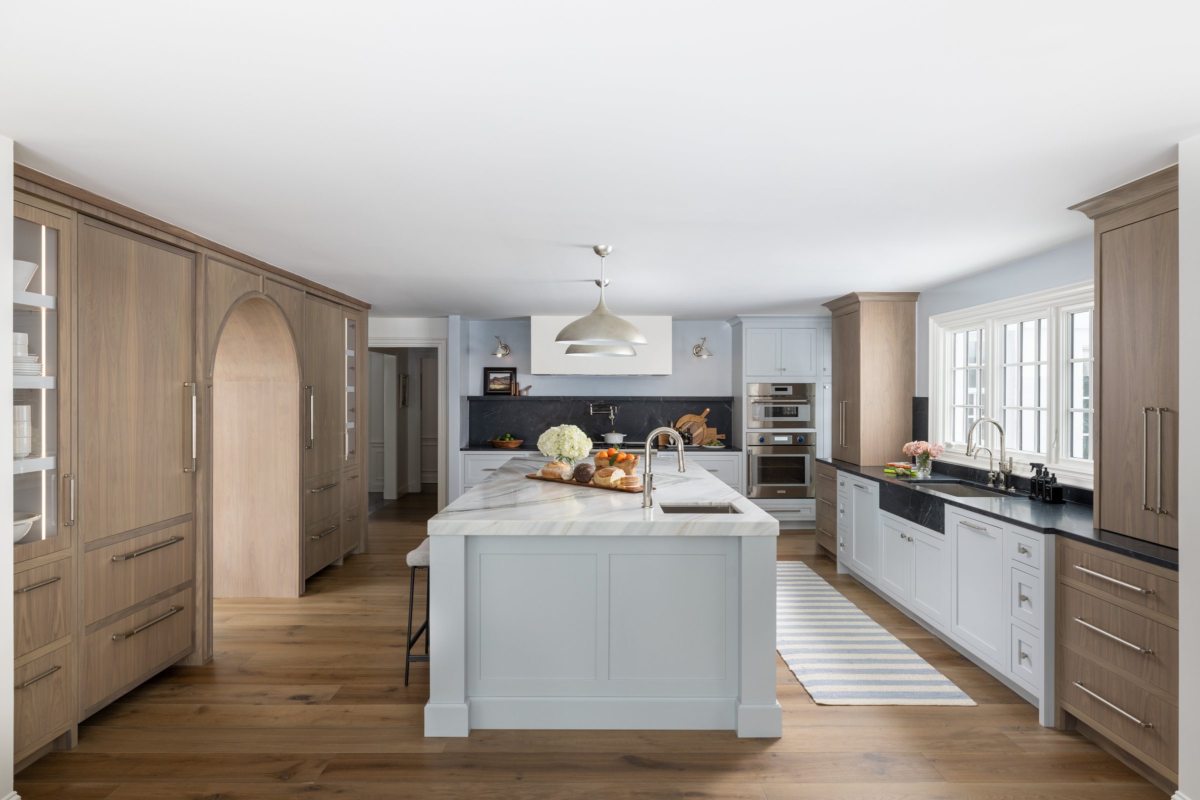 Custom kitchen with a light island, built by Mosher Dolan