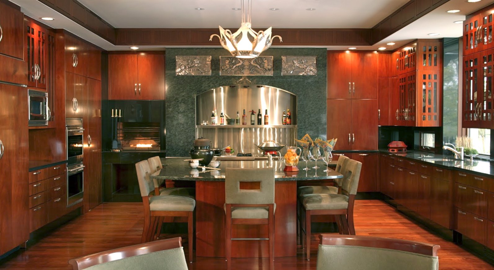 The kitchen: cherry cabinetry, green granite, and a stainless cooking alcove