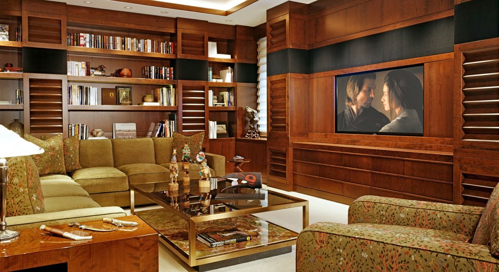 The media room, paneled in cherry with louvered doors