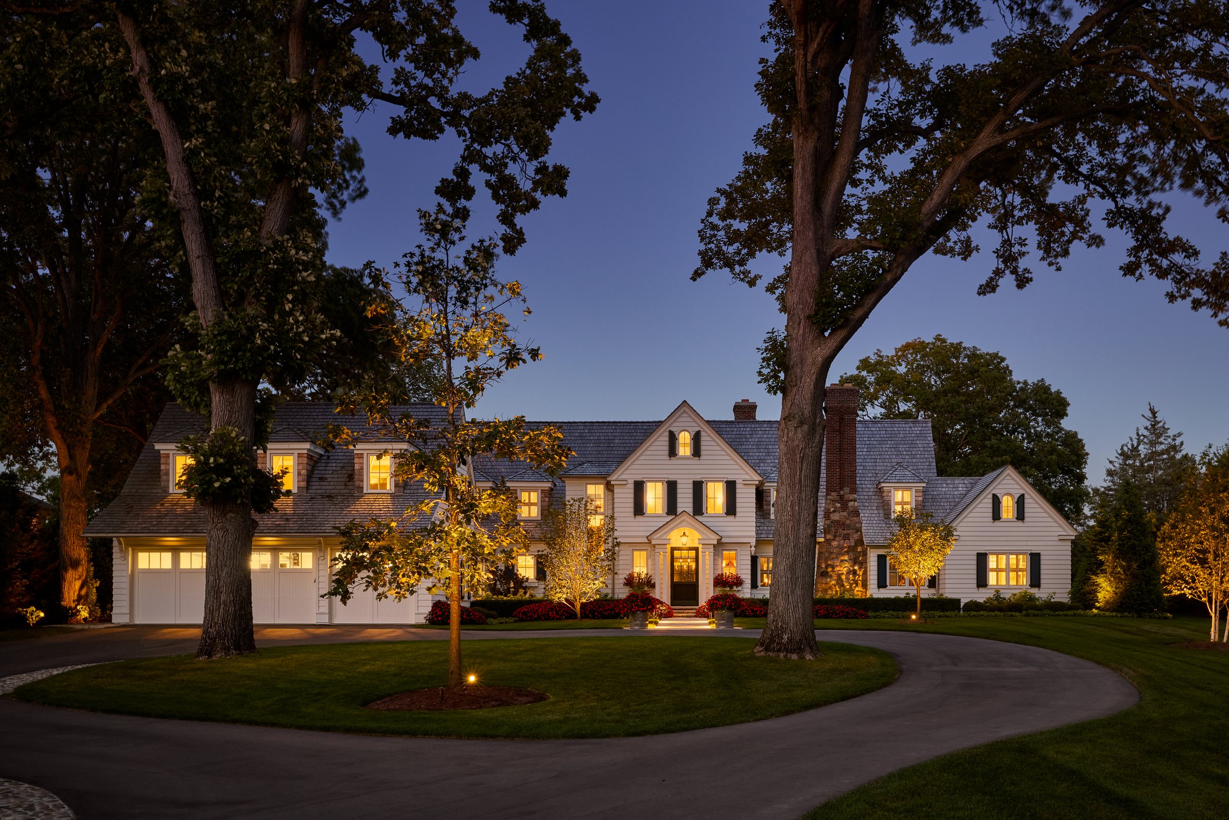 The shingle-style estate at twilight