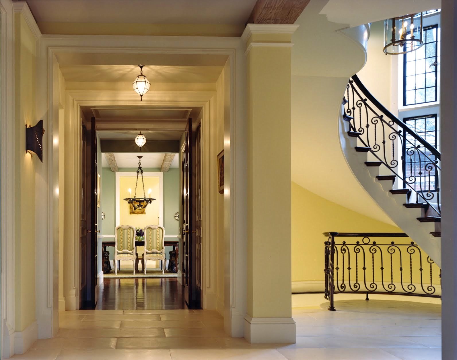 The hall, looking through to the dining room, with the stair curving up beside it