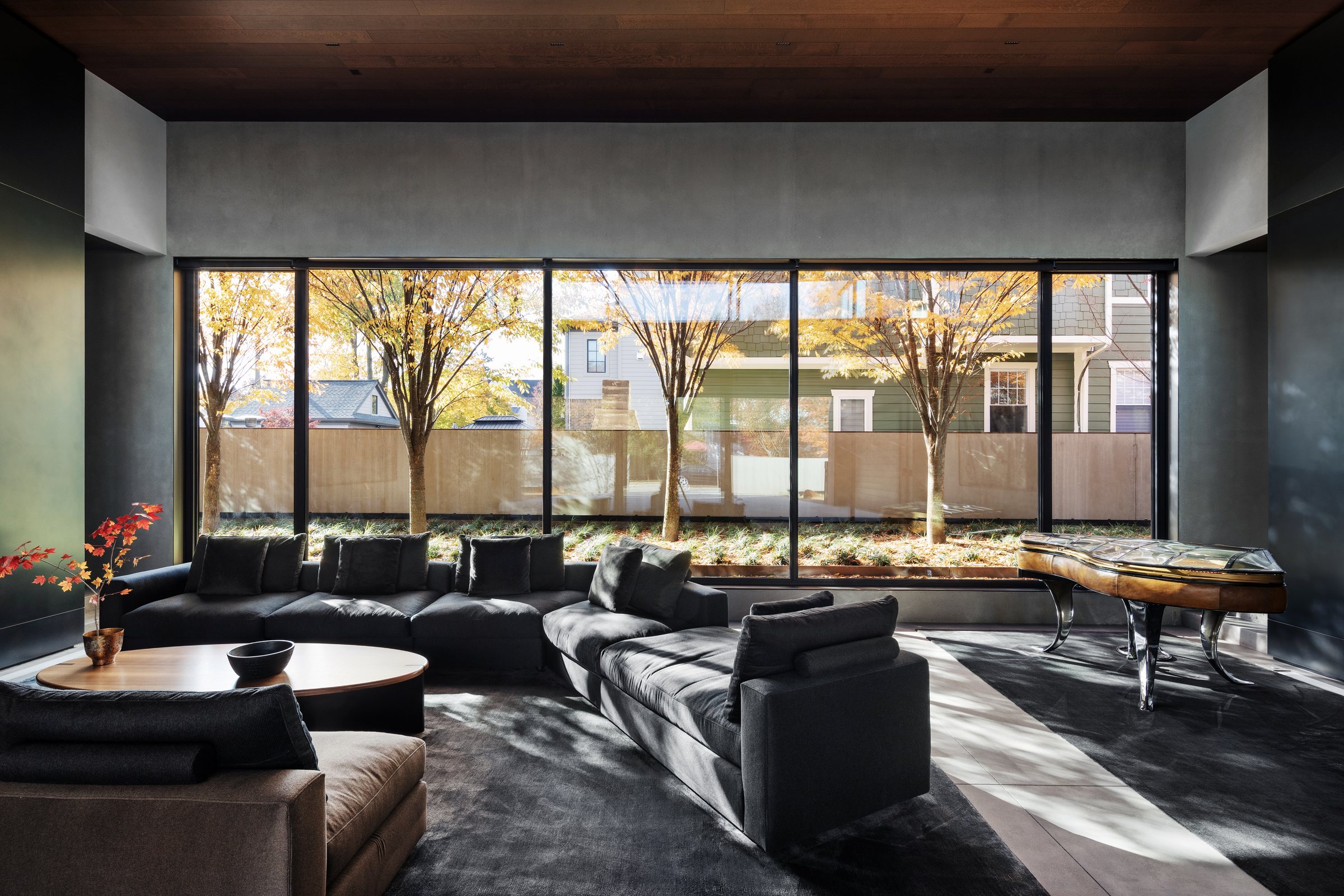 Family room at Modern in the Trees, wrapped in warm wood and glass