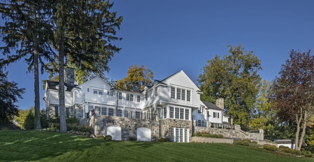 Rear elevation of the house seen across the lawn